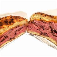 Roast Beef & Cheddar · Roast beef and cheddar on an onion roll with a choice of dijon mustard or horseradish sauce.