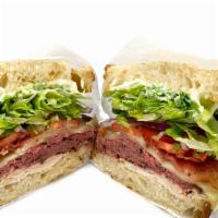 Club Supreme · Turkey, roast beef, bacon, provolone, lettuce, tomato, onion, and mayo on sourdough bread.
