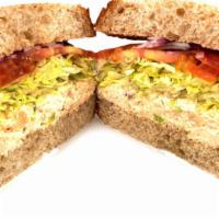 Chicken Salad Sandwich · Chicken salad, lettuce, tomato, and onion on wheat bread.