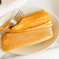 Humitas · Fresh corn tamales filled with cheese.