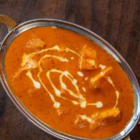 Chicken Tikka Masala · Tandoor roasted chicken pieces cooked in a creamy spiced tomato sauce.