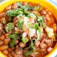 Borracho Beans · Pinto beans, bacon, chorizo, al pastor pork, tomatoes jalapeño, garlic.