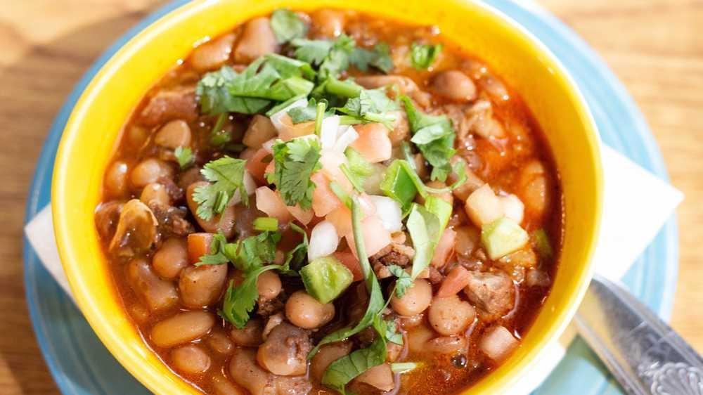 Borracho Beans · Pinto beans, bacon, chorizo, al pastor pork, tomatoes jalapeño, garlic.