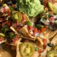 Nacho Kit · Choice of 2 proteins, fancy queso, black beans, pico de gallo, pickled red jalapeno, pickled...