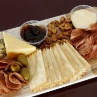 Charcuterie Kit For Two · A selection of 3 specialty cheeses, imported and cured salami, candied walnuts, fig jam, oli...