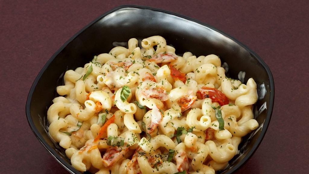 Modern Mac & Cheese · Curly cavatappi pasta with creamy bianca cheese sauce. Choice of any two sides.