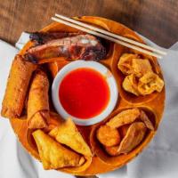 Pu Pu Platter · Includes: two egg rolls, two crab rangoon, four fried won tons, two fan tail shrimp, two spa...