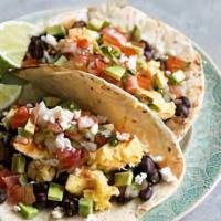 Baja Breakfast Tacos · Three soft corn tortillas filled with scrambled eggs, chorizo and mixed cheeses. Served with...