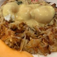 Crab Meat Benedict · An English muffin topped with asparagus, crabmeat, two poached eggs, and out homemade hollan...