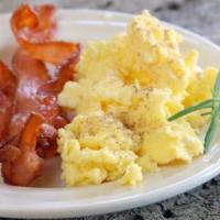 Classic Bacon & Eggs · Scrambled eggs, bacon, and brioche toast with butter and jam on the side. Our brioche bread ...