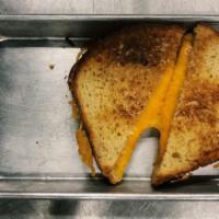 Grilled Cheese · Grilled cheese made on our in-housemade brioche bread.