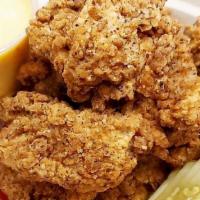 Chicken Bites · Breaded deep-fried chicken chunks.