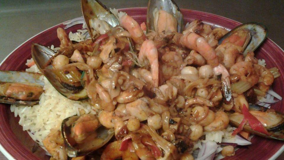 Arroz Con Mariscos · Rice with seafood.