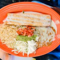 Chimichanga · Deep fried beef or chicken tortilla, topped with queso sauce. Served with rice, beans and le...