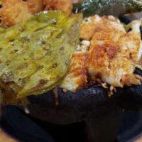 Molcajete Cancun · Breaded shrimp, grilled shrimp, scallops, tilapia, onions, bell peppers, tomatoes and cactus...
