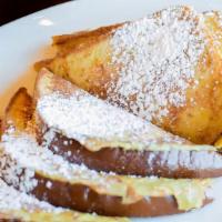 Twin French Toast · Topped with powdered sugar. ADD CHOICE OF TOPPING for an extra charge: Apple Cinnamon - Peca...