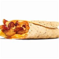 Egg-Normous Burrito · Featuring a generous serving of savory sausage, thick-cut smoked bacon, lots of fluffy eggs,...