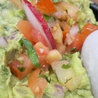 Guacamole · Vegan. Fresh made daily, our guacamole is comprised of cilantro, onion, tomato and just enou...
