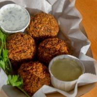 Falafel · Vegetarian. Four pieces to order served with side of curried yogurt and hot chimichurri