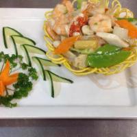 Seafood In A Bird Nest · Lobster meat, shrimp, scallop, crabmeat, pea pod, corn, mushroom, carrot and bok choy in a n...