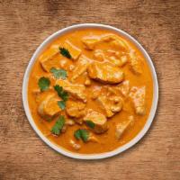 Butter Chicken Delight  · Tender chunks of char grilled tandoori chicken in a In A Light Creamy Tomato Sauce And House...