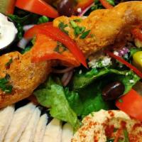 Chicken · With Greek salad, hummus, pita, and garlic dip
