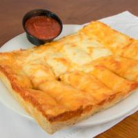 Cheesy Bread · Fresh shield’s dough brushed with garlic-Parmesan butter, topped with mixed cheeses, baked a...