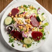 Greek Salad · Fresh mixed greens topped with whole milk Feta cheese, tomatoes, beets, sliced red onions, i...