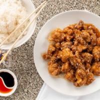 Sesame Chicken · Breaded chicken smothered with a sweet tangy sesame sauce. Served with white rice.