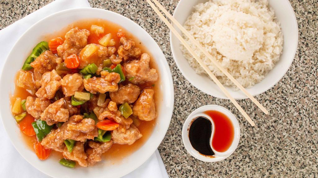 Sweet & Sour Chicken · Tender pieces of chicken lightly battered and deep fried, combined with pineapple, green peppers, and carrots in our famous sweet & sour sauce.  Served with white rice.