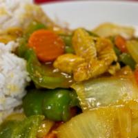 Curry Chicken · Chicken breast sauteed with garlic, sliced Spanish onions, and green peppers. Blended with c...
