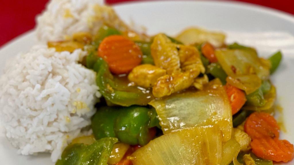Curry Chicken · Chicken breast sauteed with garlic, sliced Spanish onions, and green peppers. Blended with curry and other seasoning into a delicate Cantonese sauce.  Served with white rice.