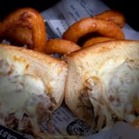 Wixom Cheesesteak · Hot, thinly sliced prime rib, grilled onions, and mushrooms, provolone cheese on a brioche h...