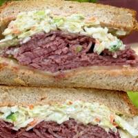 New Yorker · Corned beef, swiss cheese, coleslaw, Russian dressing on grilled rye.