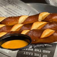 Beer Cheese And Soft Pretzels · 3 - Baked and salted pretzels served with our pub-style warm craft beer cheese.
