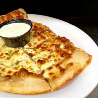 Feta Bread · Feta infused cheese bread topped with garlic butter served with ranch.