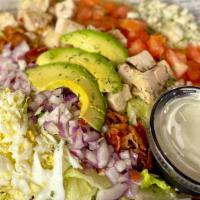 Ty-Cobb · Chopped grilled chicken, bacon, tomatoes, red onions, boiled egg, blue cheese, avocado, over...