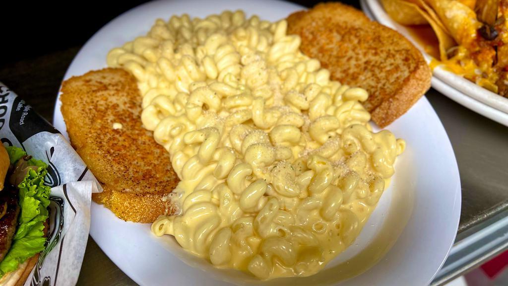 Pub Mac And Cheddar · Bubbly cheese sauce and cavatappi pasta topped with more cheese, seasoned bread crumbs, and baked. Served with garlic rye toast.