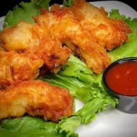 Chicken Tempura Tenders · Strips of chicken breast, battered and fried. Served with sweet chili sauce.