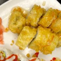 Kaley Roll  · Pineapple and cream cheese tempura fried and laced with coconut mango sauce.