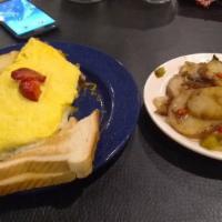 Ham Omelet · Served with hash browns or american fries and toast.