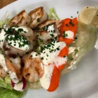 Lettuce Wrapped Shrimp · Juicy grilled shrimp on top a crisp lettuce wrap with a side of jersey sauce