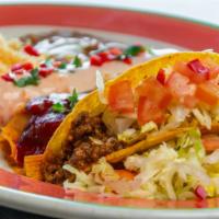 Sol Combo Plate · One cheese enchilada, one ground beef crispy taco, and one tamale, with rice and refried bea...