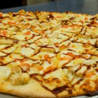 Jamaican Jerk Chicken Pizza · A Tasty Chicken Breast, Ranch base, Tomato, Onion, and Pineapple topped with Jamaican Jerk S...