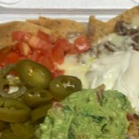Nacho Platter With Meat · Tortillas chips covered with Cheese, beans, sour cream, tomatoes and guacamole.
Meat choice ...