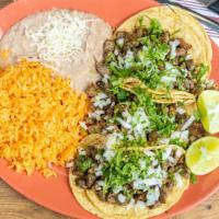Taco Dinner · Favorite. Three tacos your choice of corn or flour tortillas serve with rice and beans.