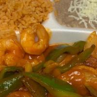 Camarones A La Veracruzana · Shrimp sautéed in butter, onions, green peppers, and ranchero sauce.