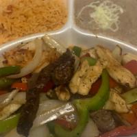 Pollo Fajitas · Chicken- delicately spiced and marinated with onions and bell peppers. Served with Spanish r...