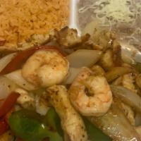 Camaron Y Pollo Fajitas · Shrimp and chicken
delicately spiced and marinated with onions and bell peppers. Served with...