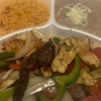 Pollo Y Res Fajitas · Chicken and steak-
delicately spiced and marinated with onions and bell peppers. Served with...